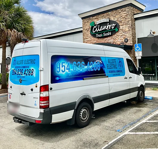 Allsite Electric service van parked outside a restaurant