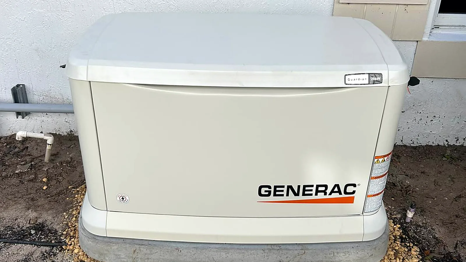 Generac Guardian 26kW home standby generator installed on a concrete pad by Allsite Electric