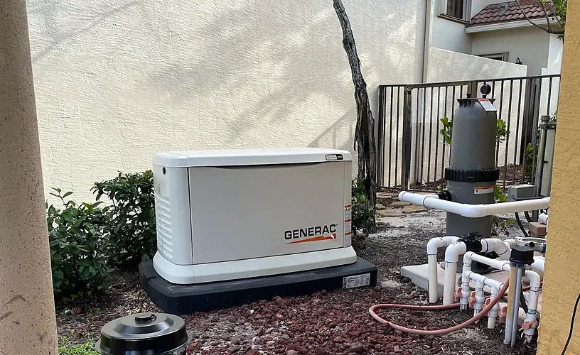 Generac home standby generator installed beside pool equipment