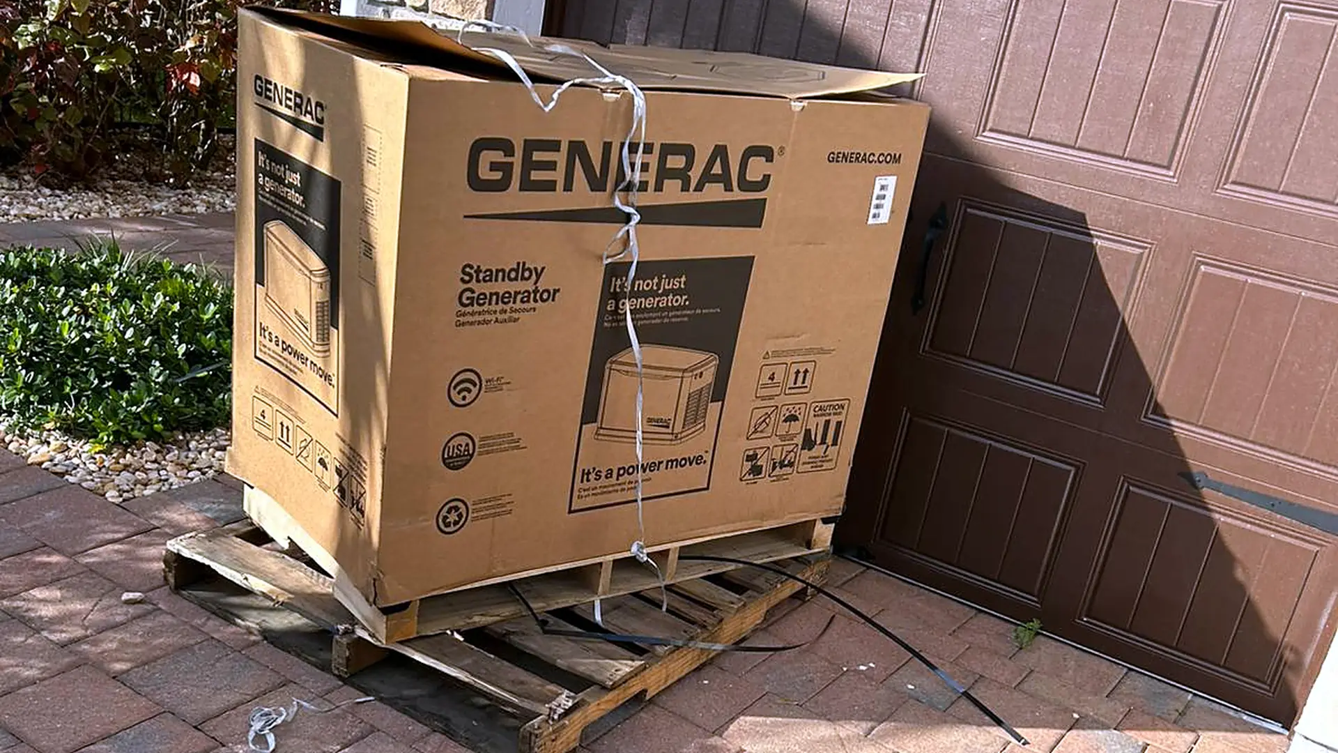 New Generac standby generator delivered on a pallet ahead of installation