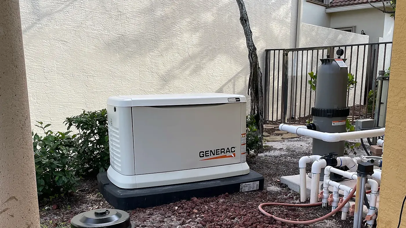 Generac home standby generator installed on a pad beside pool equipment
