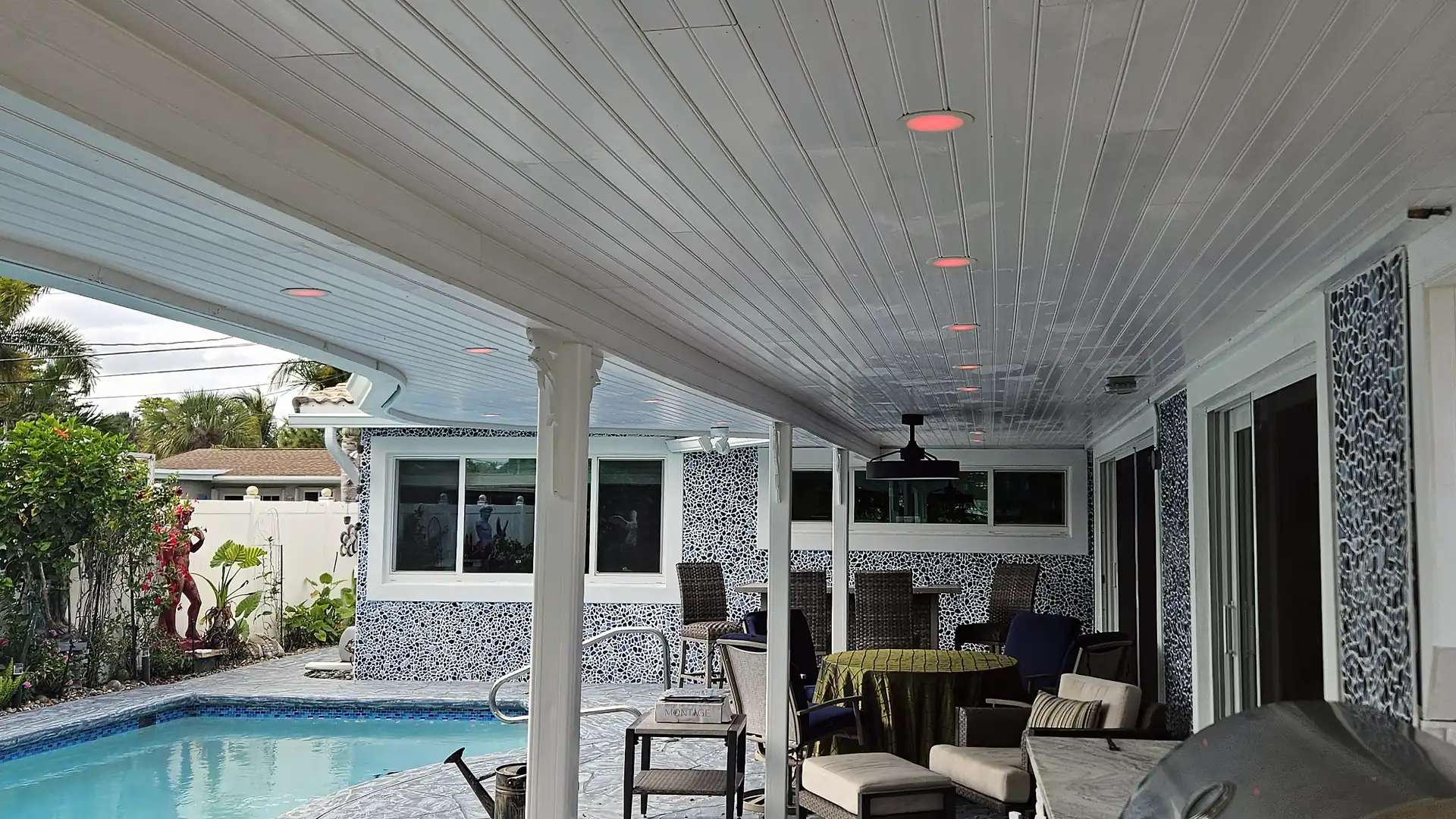 Covered pool patio with recessed ceiling lights installed by Allsite Electric