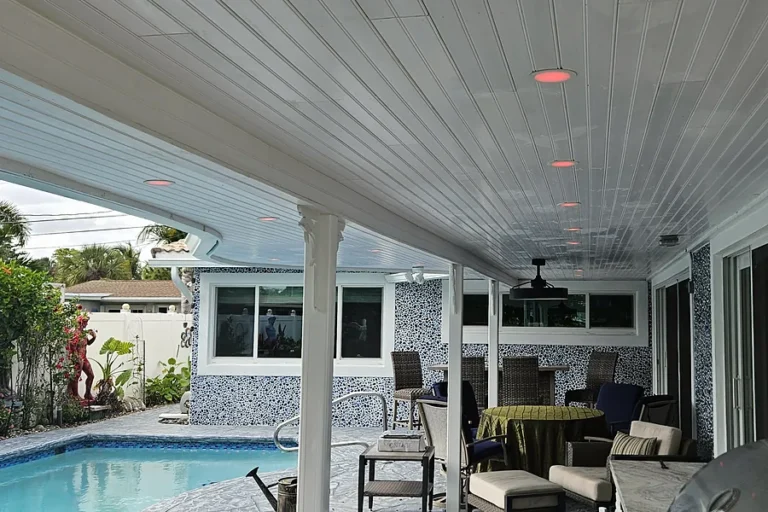 Recessed lights in a covered pool patio ceiling at a South Florida home